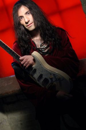 Mike Campese Promo, Yellow TA. Burgundy Shirt, Red Background.